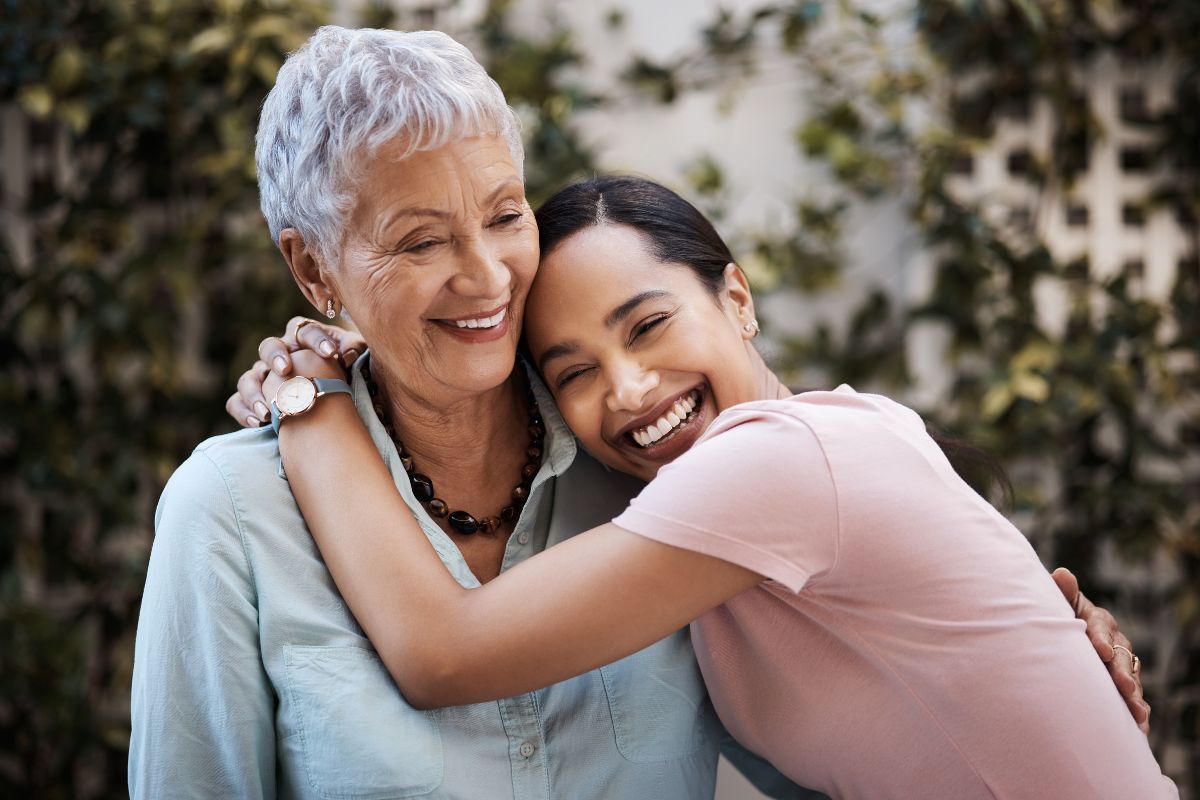 Healthy-family-smiling-top-rated-vascular-care Mother and daughter smiling together representing healthy living and vascular wellness.
